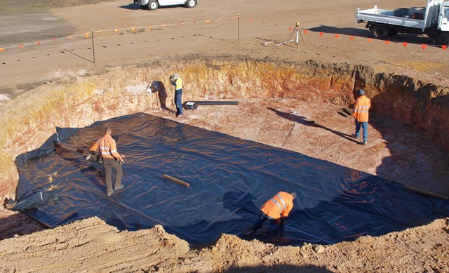 Laying the builders black plastic.